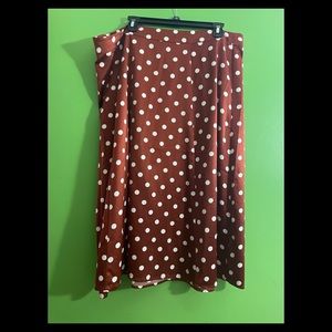 Rust colored polka dot skirt.